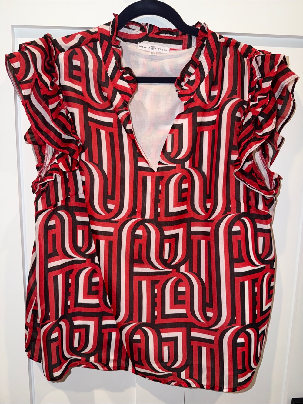 Michelle McDowell 
Red and black blouse 
XL